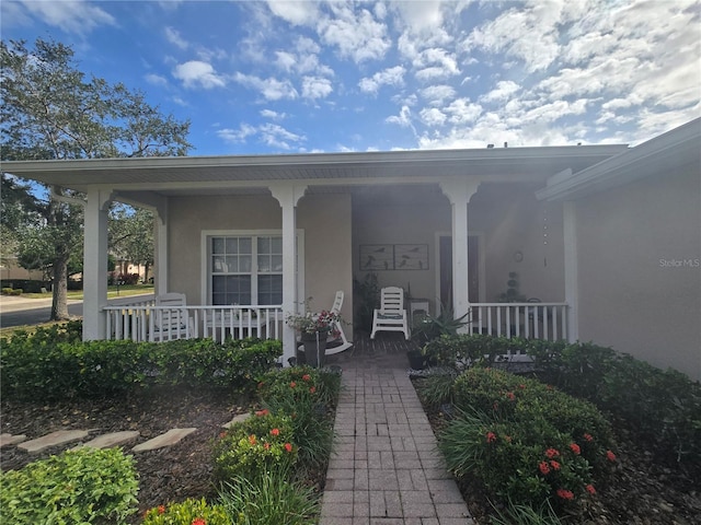 entrance to property with a porch