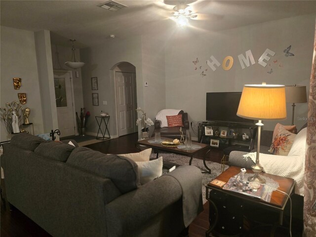 living room with ceiling fan and hardwood / wood-style floors