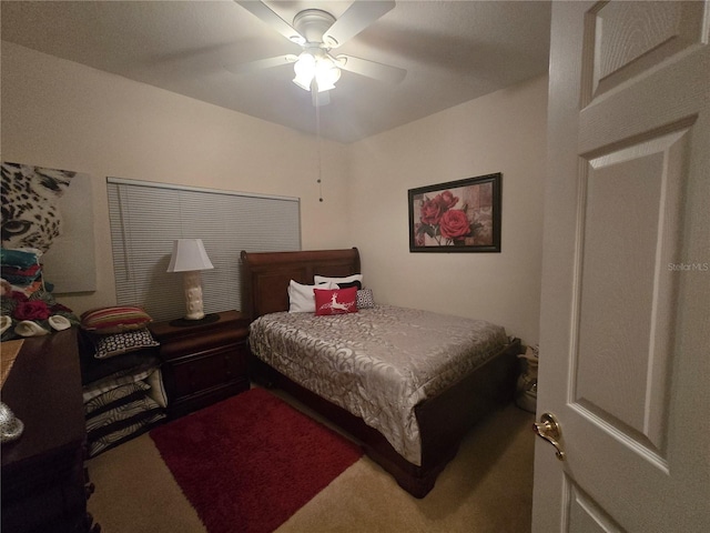 bedroom with ceiling fan and carpet floors