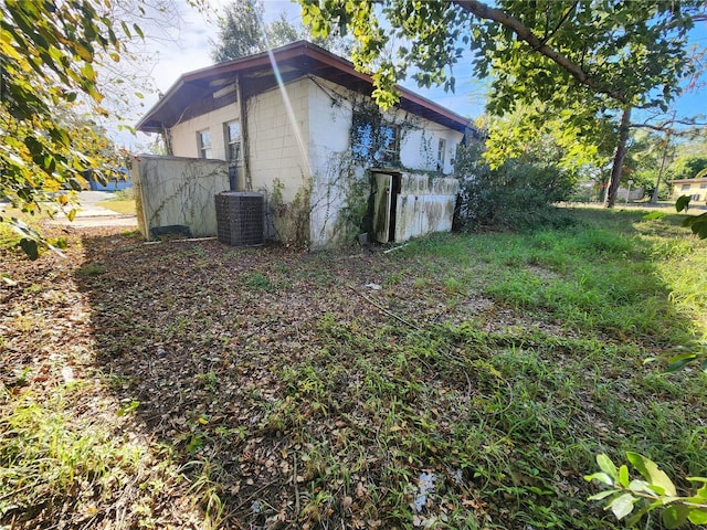 view of side of home featuring cooling unit