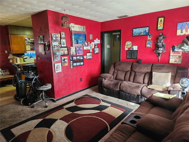 living room with carpet floors and a textured ceiling