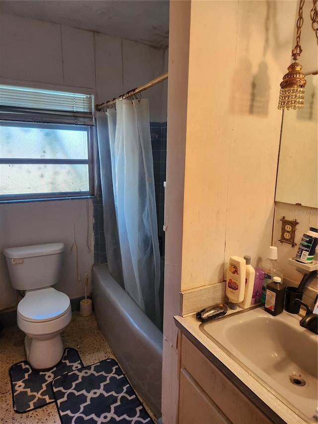 full bathroom featuring vanity, toilet, and shower / tub combo with curtain