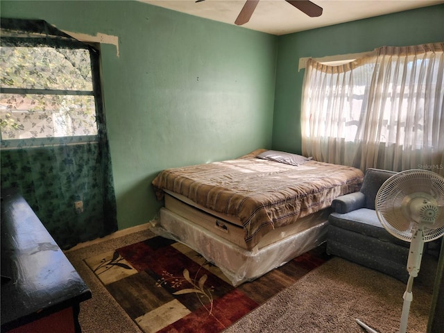 bedroom featuring ceiling fan and hardwood / wood-style flooring