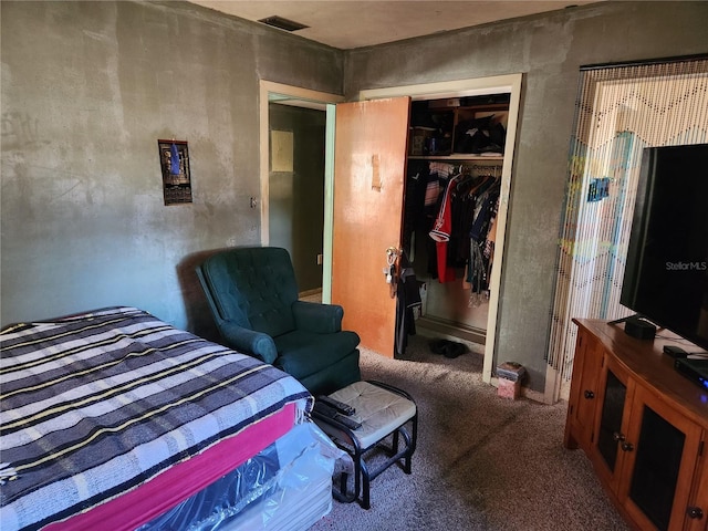 bedroom with carpet floors and a closet