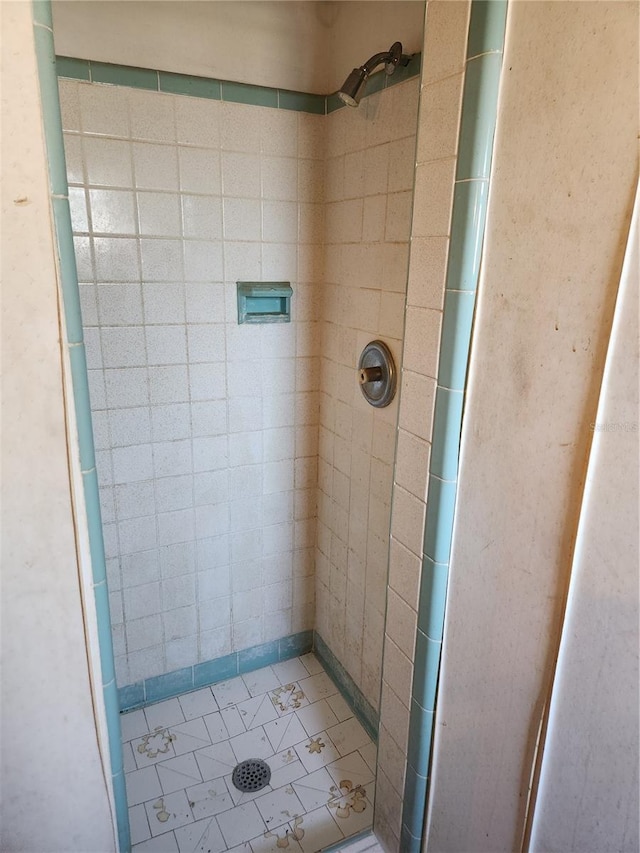 bathroom with tiled shower