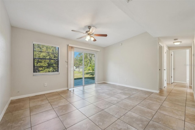 empty room featuring ceiling fan and light tile patterned floors