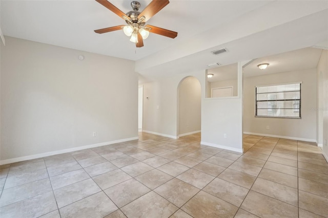 unfurnished room with ceiling fan and light tile patterned floors