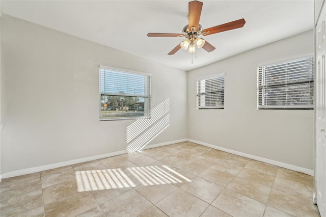 unfurnished room featuring ceiling fan and light tile patterned floors