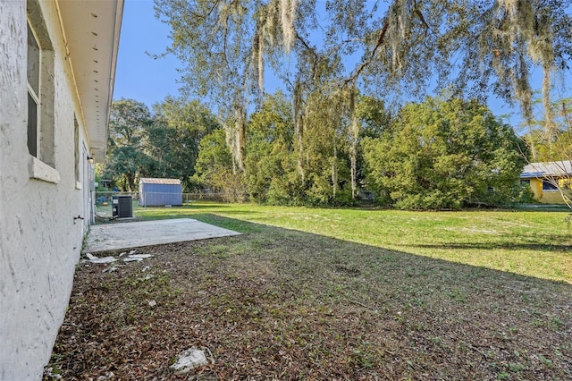 view of yard with a patio and central AC