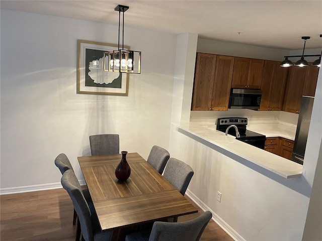 dining room with dark hardwood / wood-style floors