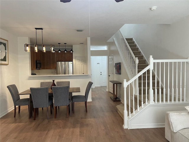 dining room featuring dark hardwood / wood-style flooring