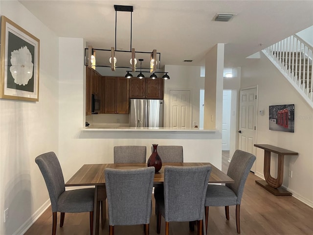 dining area featuring hardwood / wood-style flooring