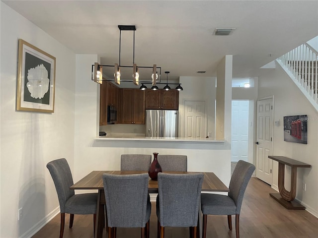 dining area with wood-type flooring