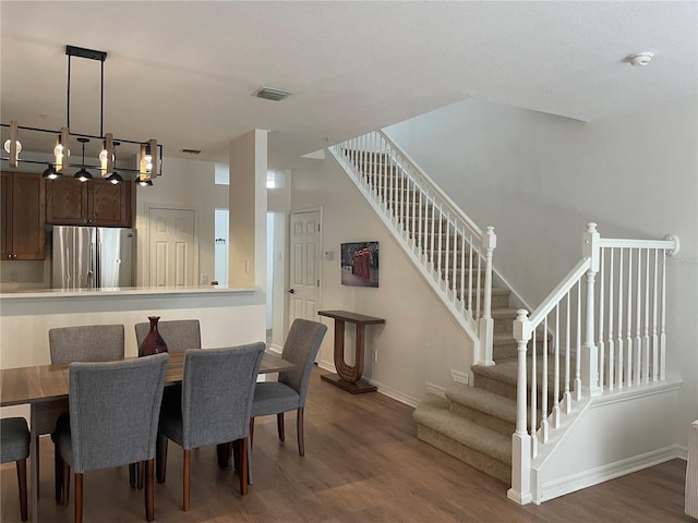 dining space featuring dark hardwood / wood-style floors