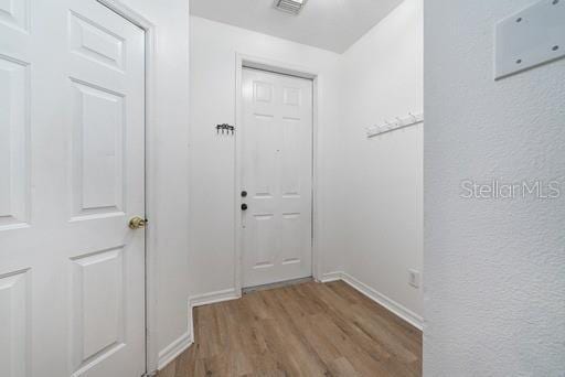 doorway to outside featuring light hardwood / wood-style floors