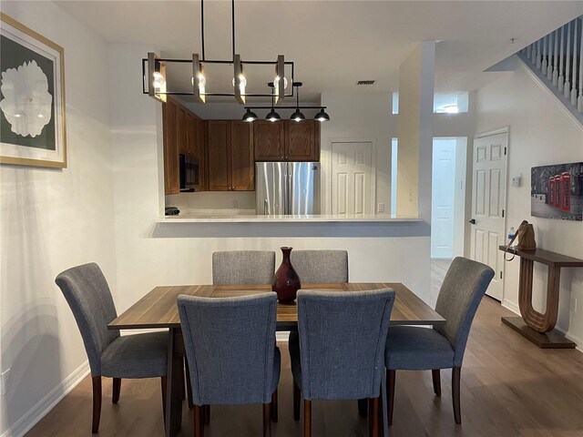 dining area featuring hardwood / wood-style flooring