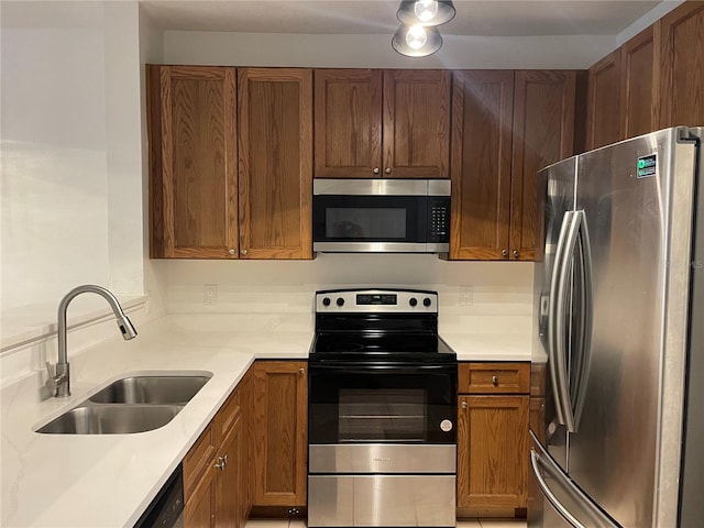 kitchen with appliances with stainless steel finishes and sink