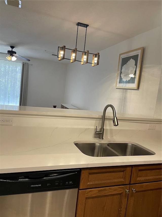 kitchen featuring pendant lighting, sink, stainless steel dishwasher, and ceiling fan