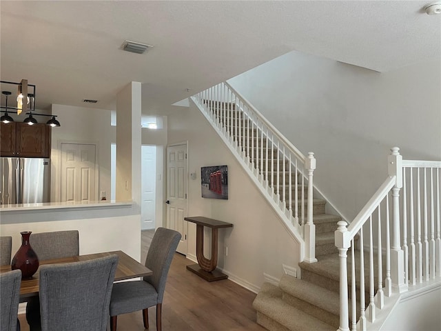 dining area with hardwood / wood-style floors