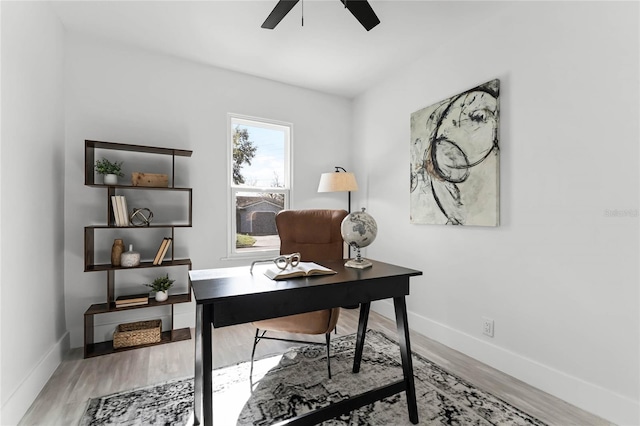 office with ceiling fan and wood-type flooring