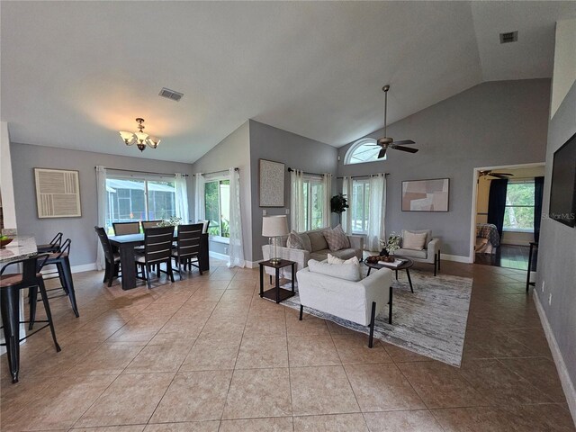 1022 Bartlett Ct, Oviedo, FL 32765 - tiled living area featuring lofted ceiling, a chandelier, healthy amount of natural light, and a ceiling fan