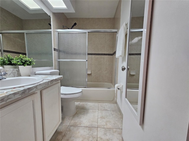 1022 Bartlett Ct, Oviedo, FL 32765 - bathroom with vanity, a skylight, enclosed tub / shower combo, and tile patterned floors