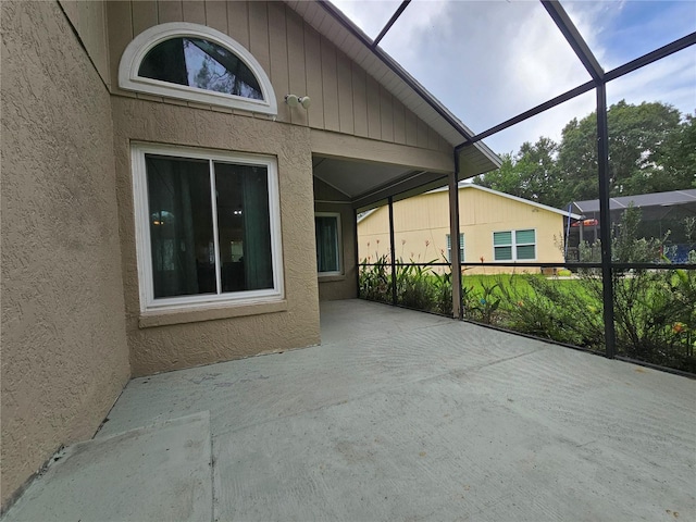 1022 Bartlett Ct, Oviedo, FL 32765 - unfurnished sunroom with lofted ceiling and plenty of natural light