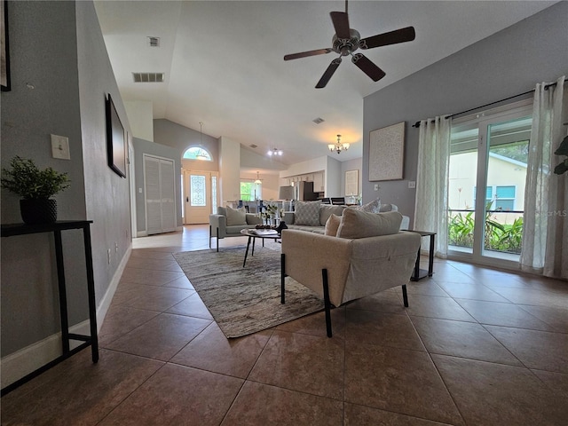 1022 Bartlett Ct, Oviedo, FL 32765 - living room featuring vaulted ceiling, ceiling fan, tile patterned flooring, and a chandelier