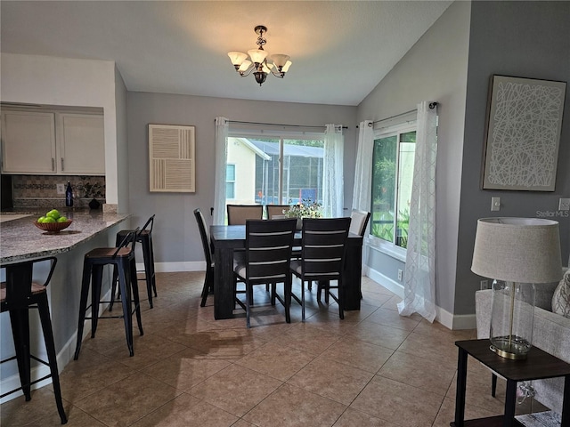 1022 Bartlett Ct, Oviedo, FL 32765 - tiled dining room featuring a chandelier and vaulted ceiling