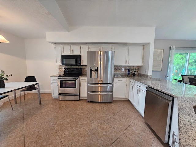 1022 Bartlett Ct, Oviedo, FL 32765 - kitchen featuring appliances with stainless steel finishes, tasteful backsplash, white cabinetry, and light stone counters