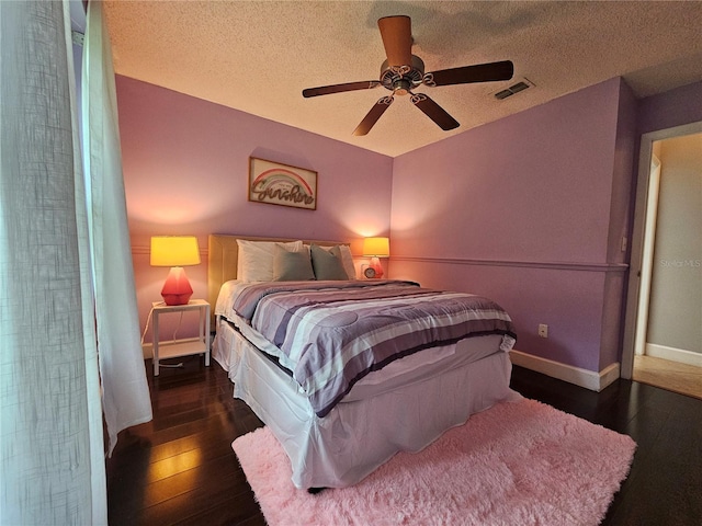 1022 Bartlett Ct, Oviedo, FL 32765 - bedroom with hardwood / wood-style flooring, ceiling fan, and a textured ceiling