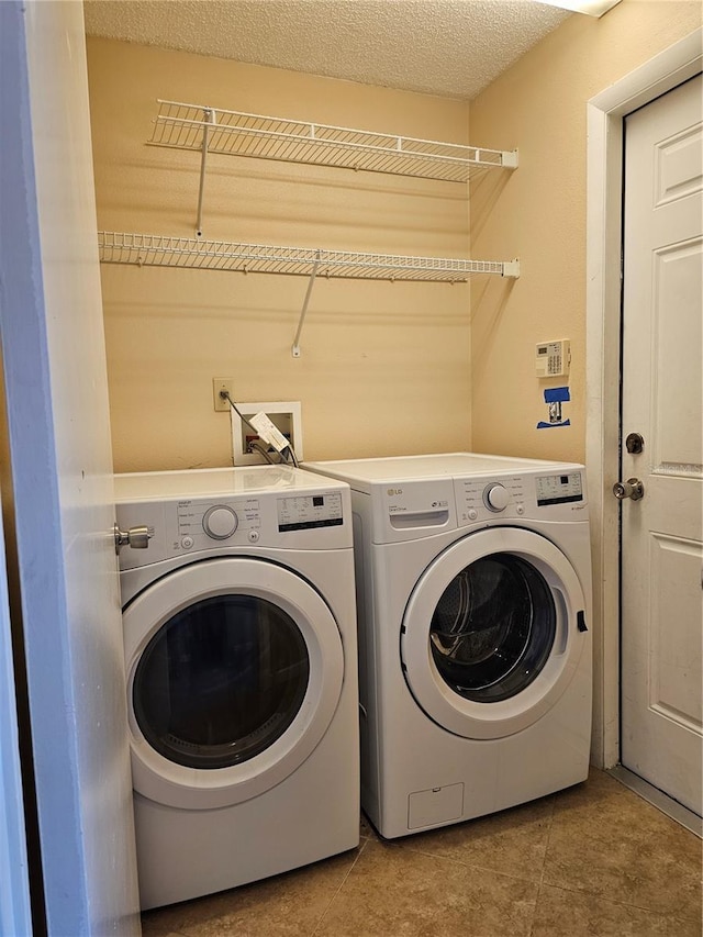 1022 Bartlett Ct, Oviedo, FL 32765 - laundry room with washer and dryer and tile patterned floors