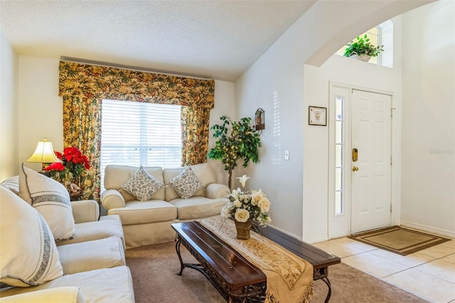 tiled living room with a textured ceiling