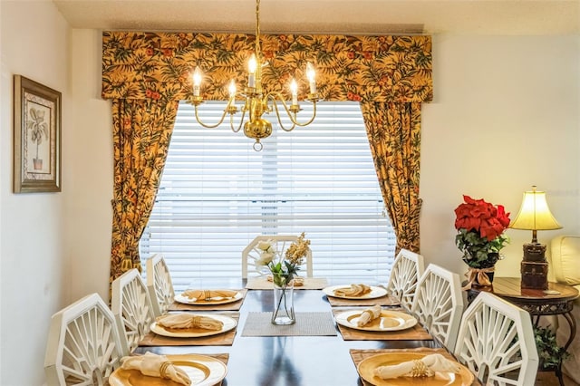 dining space with an inviting chandelier