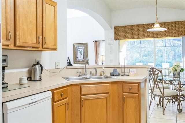 kitchen with white dishwasher, sink, hanging light fixtures, light tile patterned flooring, and kitchen peninsula