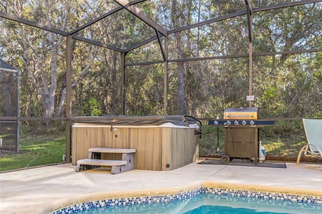 view of swimming pool with a lanai, a patio, grilling area, and a hot tub