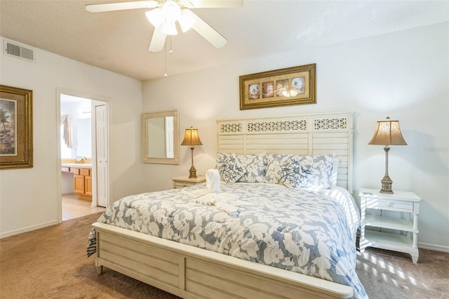 carpeted bedroom featuring ceiling fan and connected bathroom