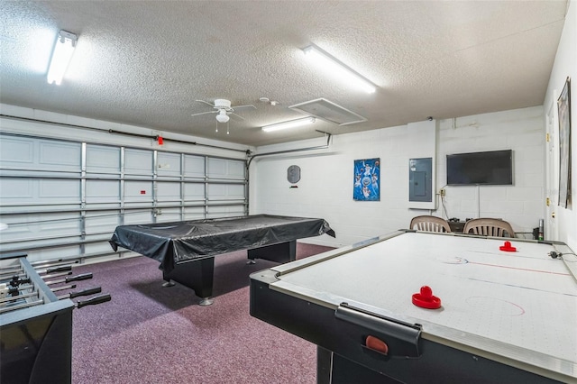 rec room with pool table, ceiling fan, a textured ceiling, and electric panel