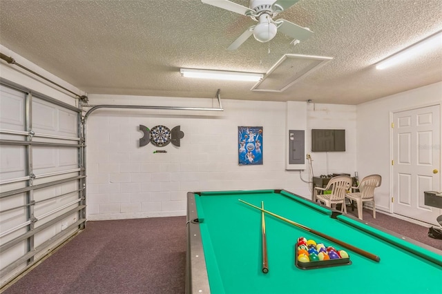 recreation room featuring a textured ceiling, electric panel, ceiling fan, and billiards