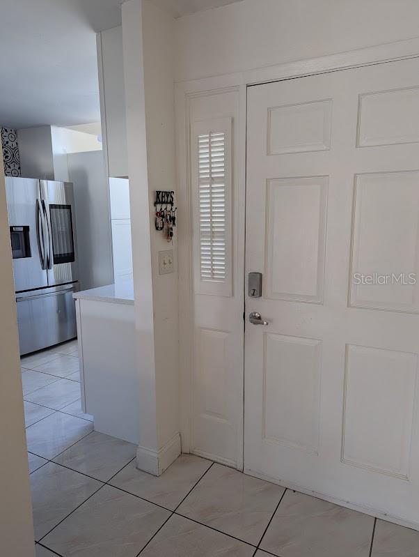 foyer with light tile patterned flooring