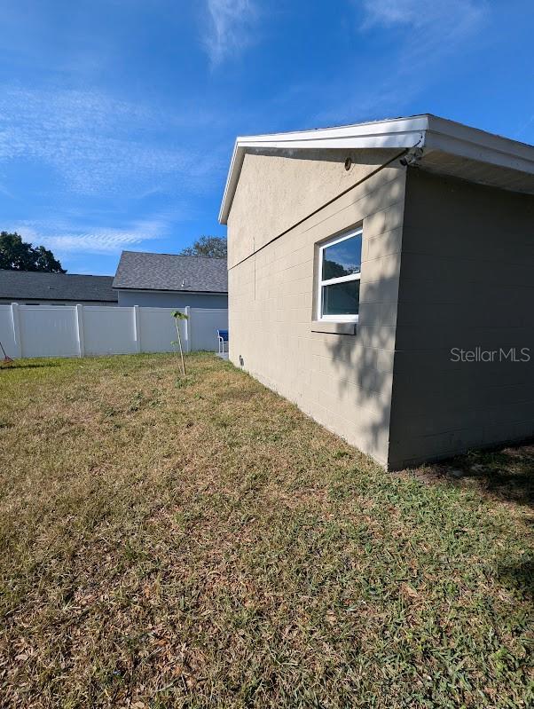 view of home's exterior featuring a yard