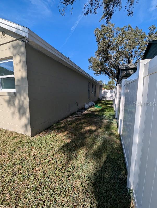 view of home's exterior featuring a yard