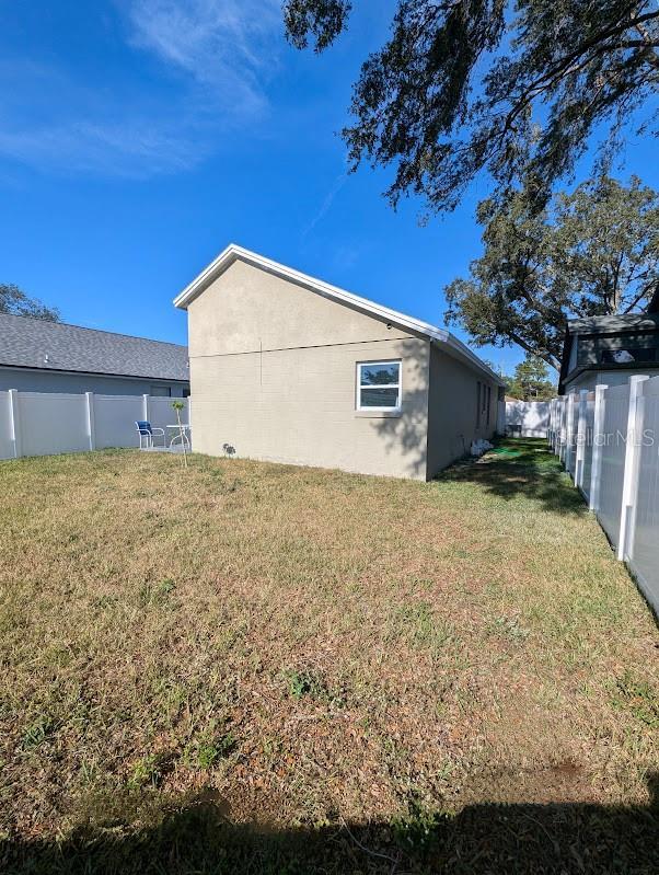 view of home's exterior with a lawn