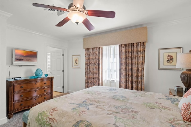 carpeted bedroom featuring ceiling fan and ornamental molding