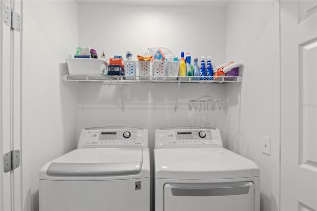 laundry room with washer and clothes dryer