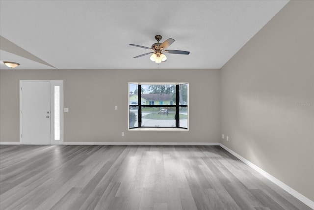 unfurnished room featuring ceiling fan and light hardwood / wood-style flooring