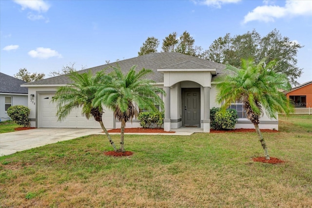 single story home featuring a garage and a front lawn