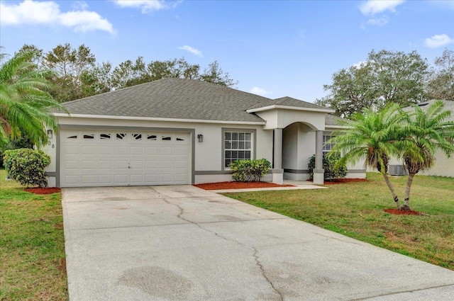 ranch-style home featuring a garage and a front yard