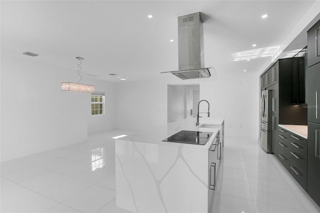 kitchen with black electric cooktop, extractor fan, sink, light tile patterned floors, and stainless steel refrigerator