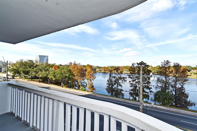 balcony featuring a water view